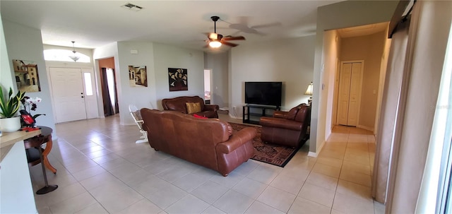 tiled living room with ceiling fan