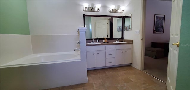 bathroom featuring a relaxing tiled bath, double sink vanity, and tile flooring