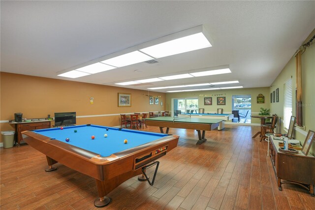recreation room with visible vents, wood finished floors, and pool table