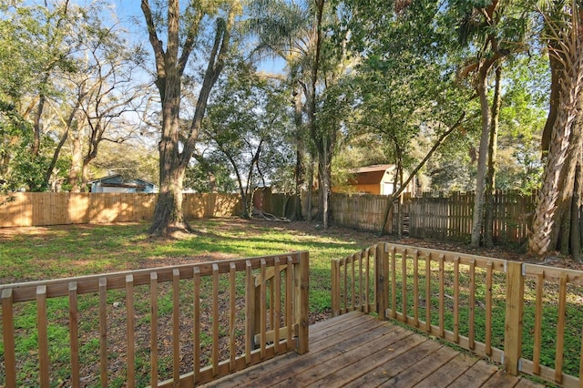 wooden deck with a lawn