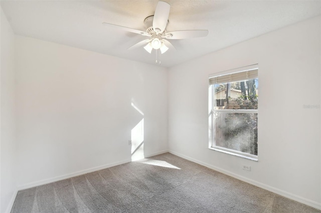 empty room featuring light carpet and ceiling fan