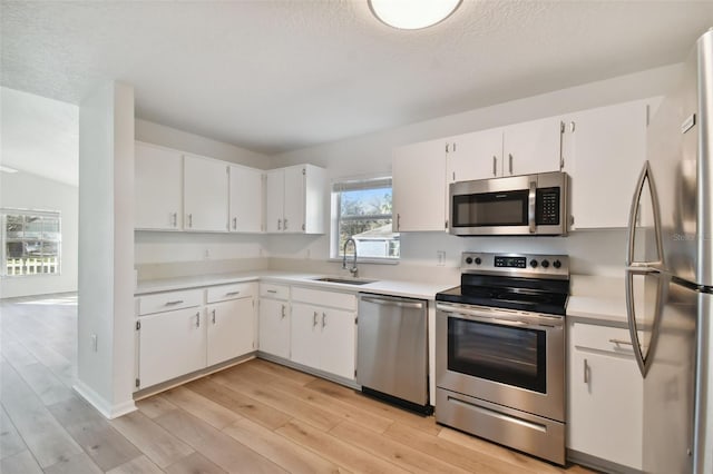 kitchen featuring white cabinets, sink, and stainless steel appliances