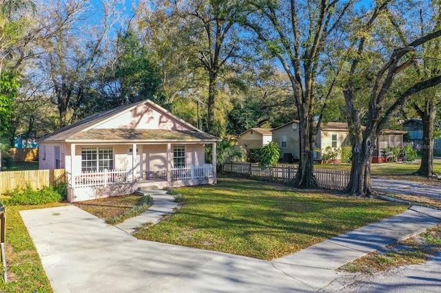 bungalow-style home with a porch and a front yard