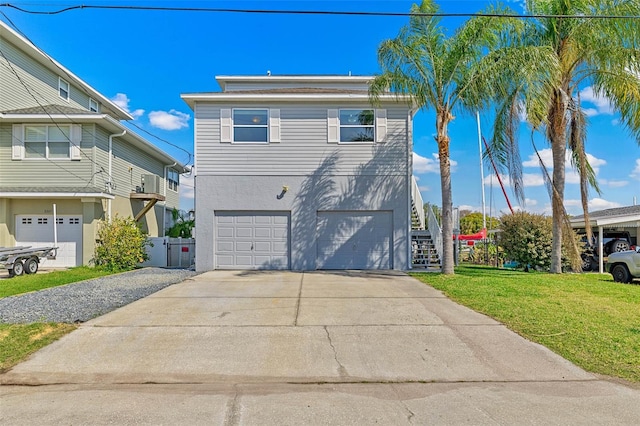 view of front of house featuring a front yard and a garage