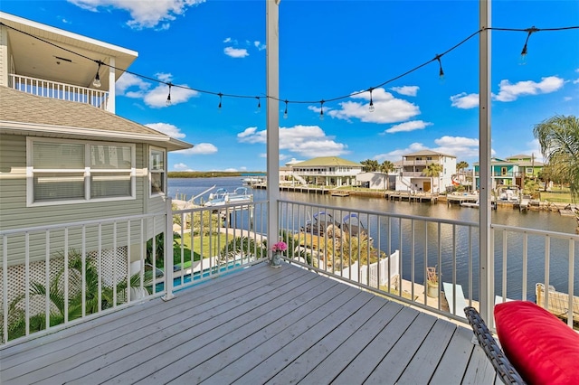 wooden terrace with a water view