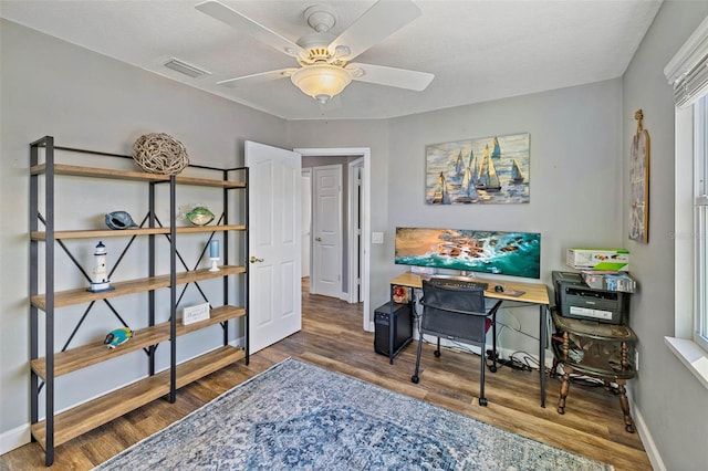 office area with ceiling fan, hardwood / wood-style floors, and a textured ceiling