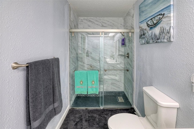 bathroom featuring toilet, a textured ceiling, and walk in shower