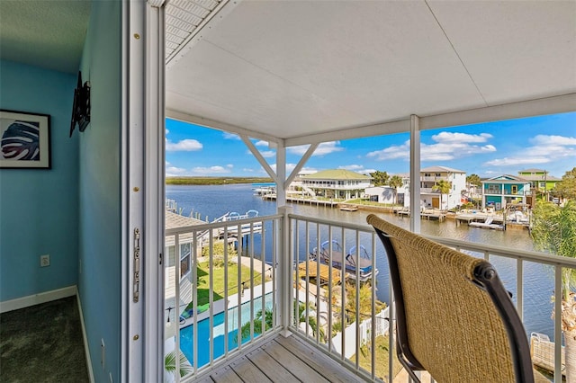 balcony featuring a water view