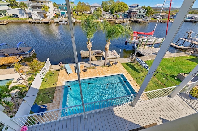 exterior space with a yard, a patio, and a water view