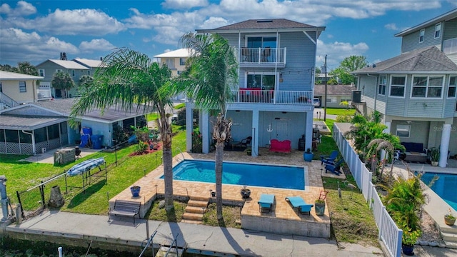 view of pool with a yard