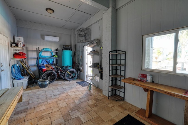 interior space with a wall mounted air conditioner