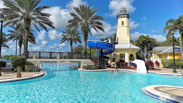 view of pool with a water slide