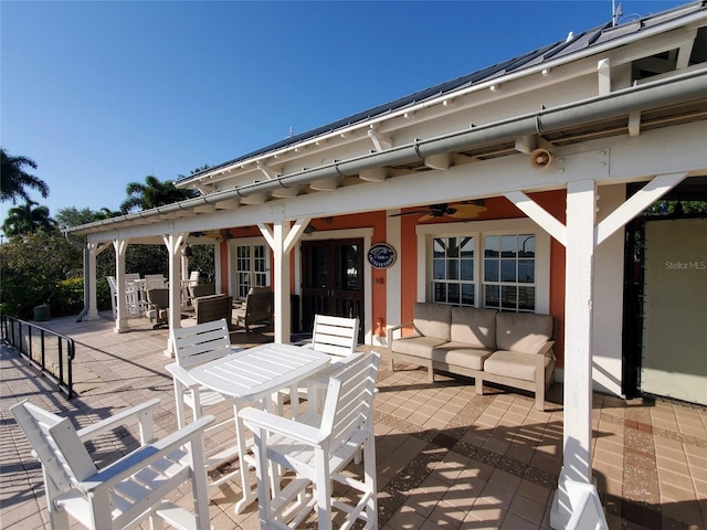 view of terrace with an outdoor hangout area and ceiling fan