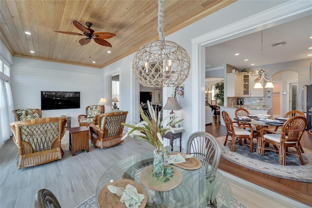 living room featuring ceiling fan, light hardwood / wood-style floors, wood ceiling, and crown molding