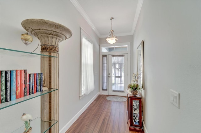 foyer featuring ornamental molding and wood-type flooring