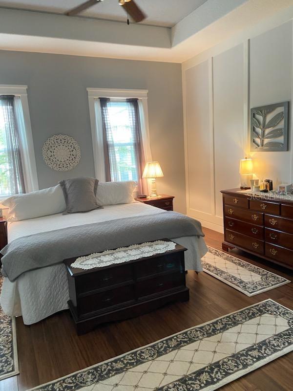 bedroom featuring dark hardwood / wood-style floors and ceiling fan