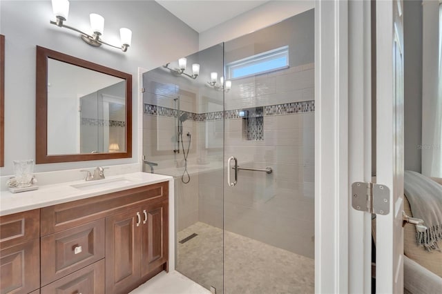 bathroom with an enclosed shower and vanity