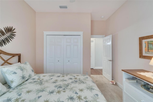 carpeted bedroom with a closet