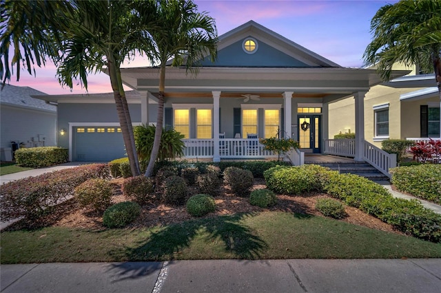 view of front of house with a garage and a porch