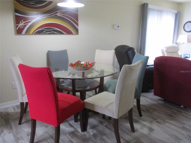 dining space featuring hardwood / wood-style flooring