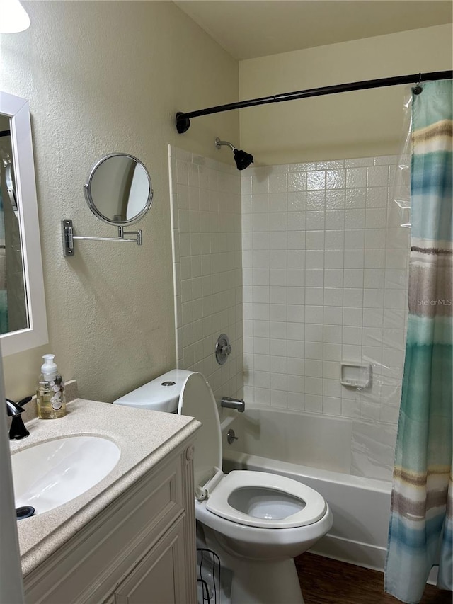 bathroom with wood-type flooring, vanity, and shower / bath combo with shower curtain