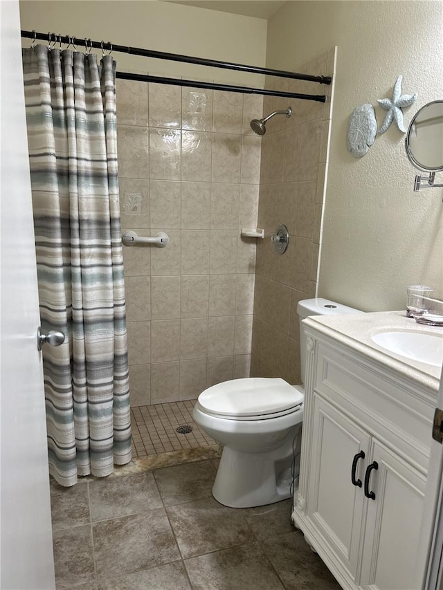 bathroom with toilet, tile patterned flooring, vanity, and a shower with shower curtain