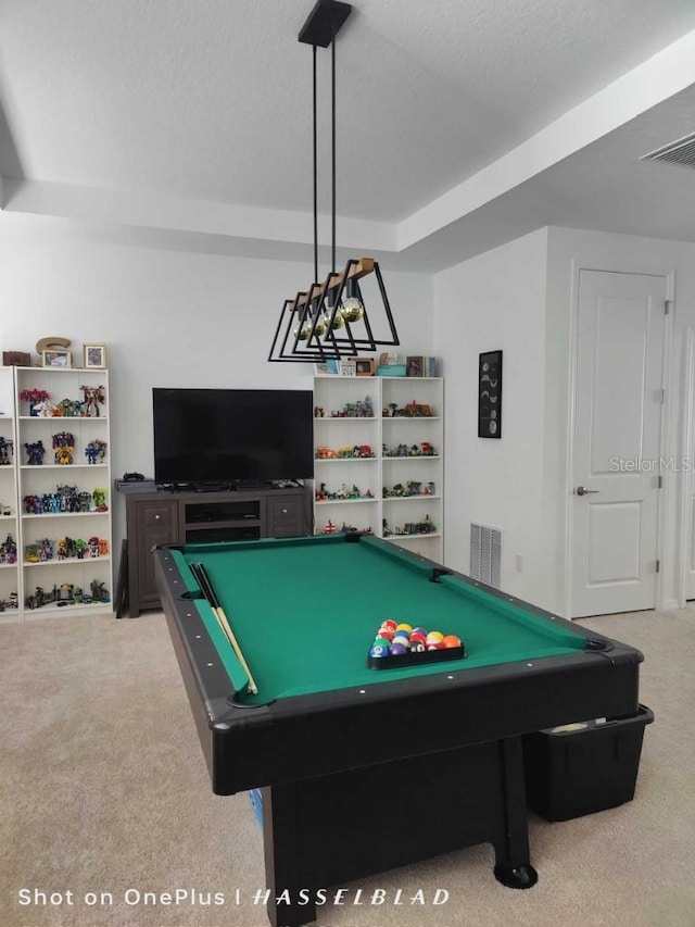 playroom featuring light colored carpet, pool table, and a textured ceiling