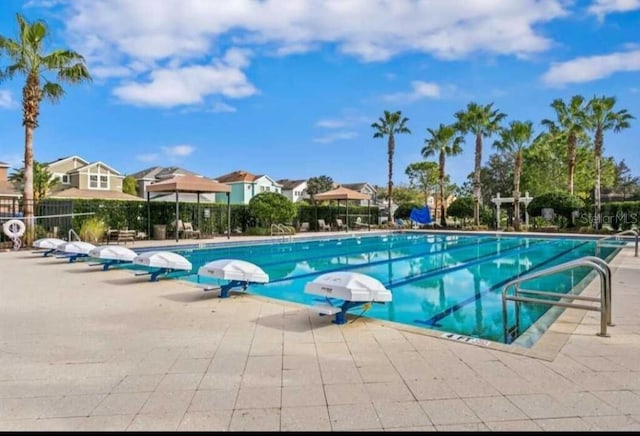 view of pool featuring a patio