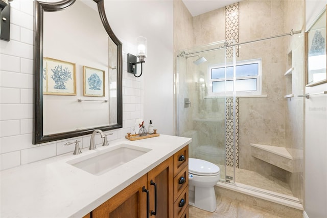 bathroom with an enclosed shower, vanity, toilet, and tile patterned flooring