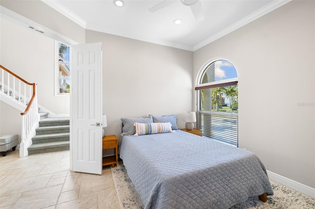 bedroom with ceiling fan and ornamental molding