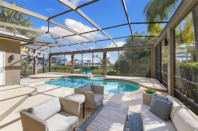 view of pool featuring a lanai, a patio area, and an in ground hot tub