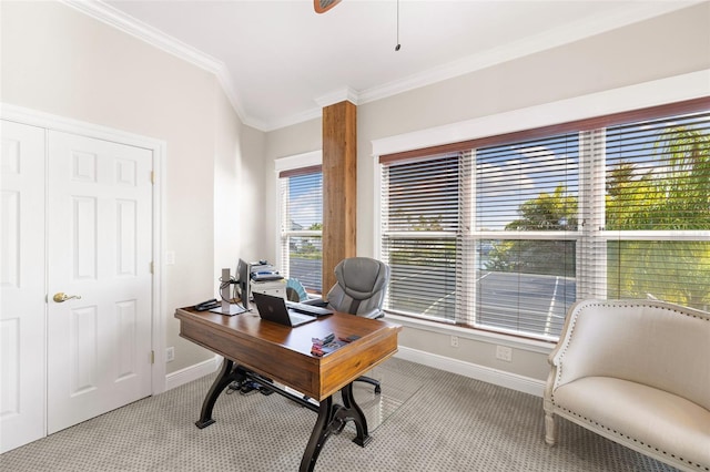 home office featuring ceiling fan, a healthy amount of sunlight, light colored carpet, and ornamental molding