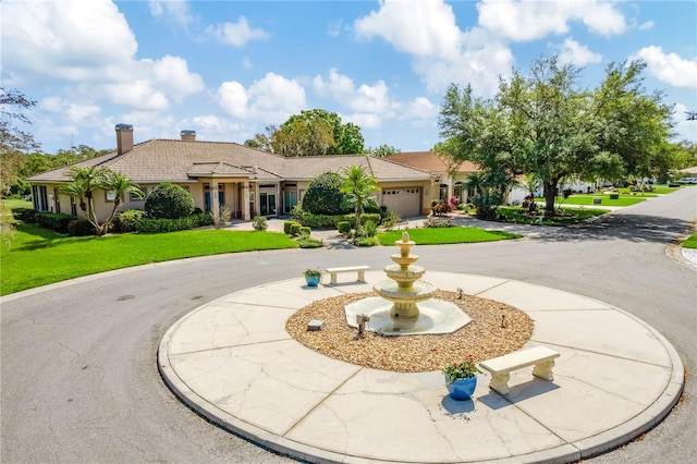 exterior space featuring a front yard and a garage