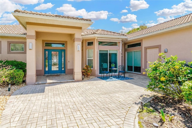 doorway to property featuring french doors