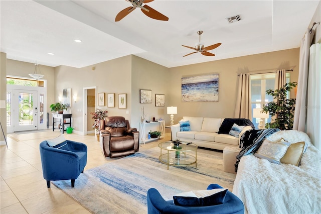 tiled living room featuring ceiling fan