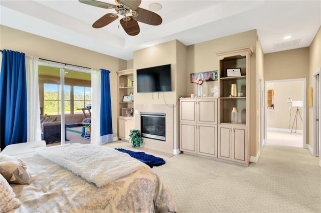 carpeted bedroom featuring access to exterior and ceiling fan