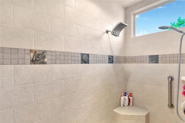 bathroom with a tile shower