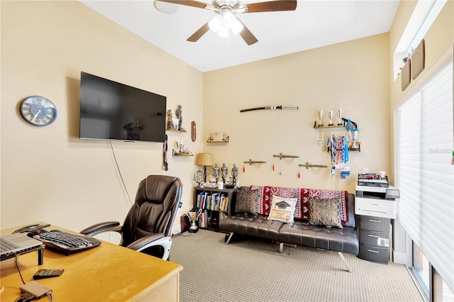 office area featuring light colored carpet and ceiling fan