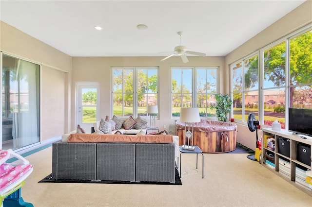 sunroom / solarium with ceiling fan