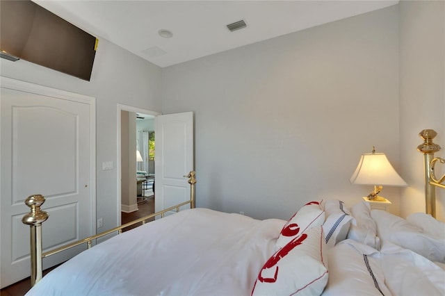 bedroom featuring dark hardwood / wood-style flooring