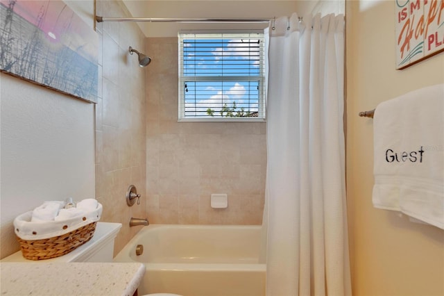 full bathroom with vanity, shower / tub combo with curtain, and toilet