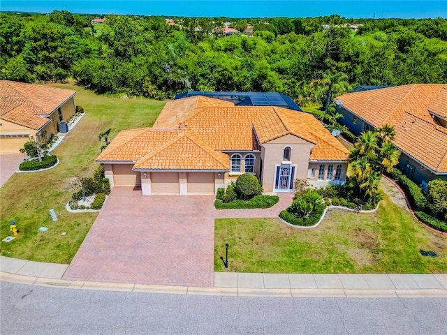 view of front of house featuring a front yard and a garage