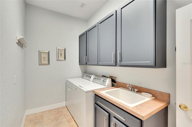 clothes washing area featuring independent washer and dryer, sink, light tile floors, hookup for a washing machine, and cabinets