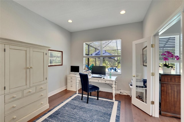 home office with french doors and dark hardwood / wood-style flooring