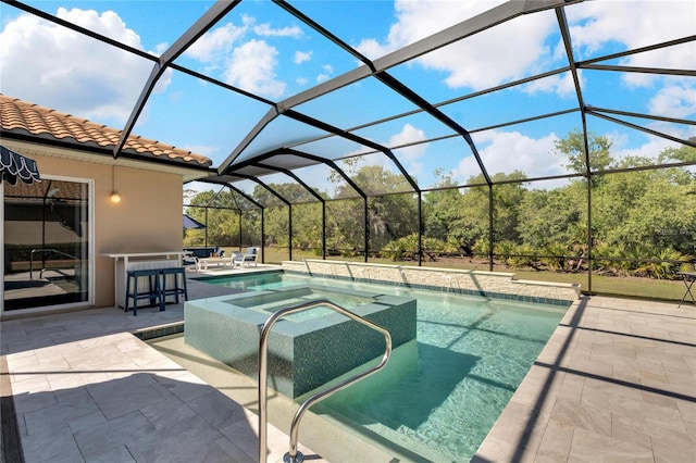 view of pool featuring a patio area, an in ground hot tub, and glass enclosure