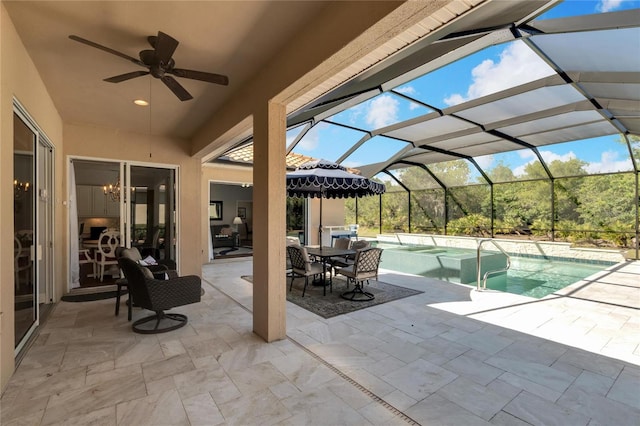 view of pool with a jacuzzi, ceiling fan, a patio, and a lanai