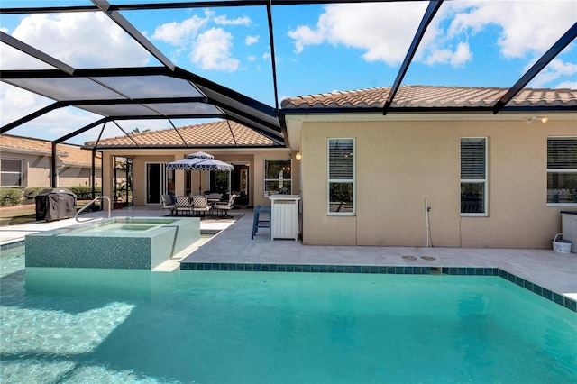 view of swimming pool with glass enclosure and a patio