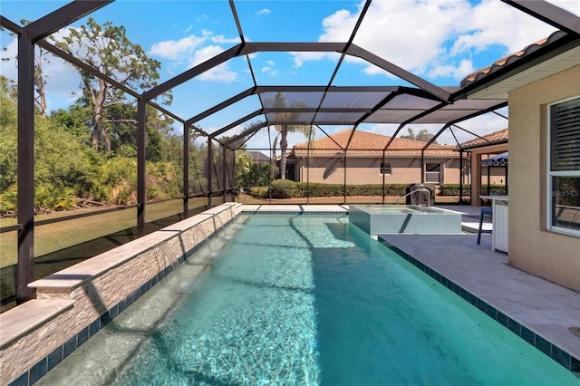 view of pool with a patio, a lanai, and pool water feature