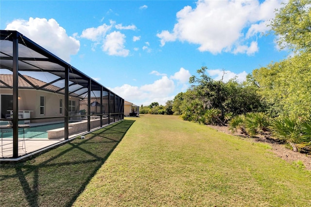 view of yard with glass enclosure