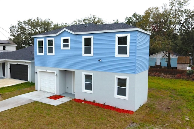 view of front of home with a front yard, roof with shingles, driveway, and stucco siding